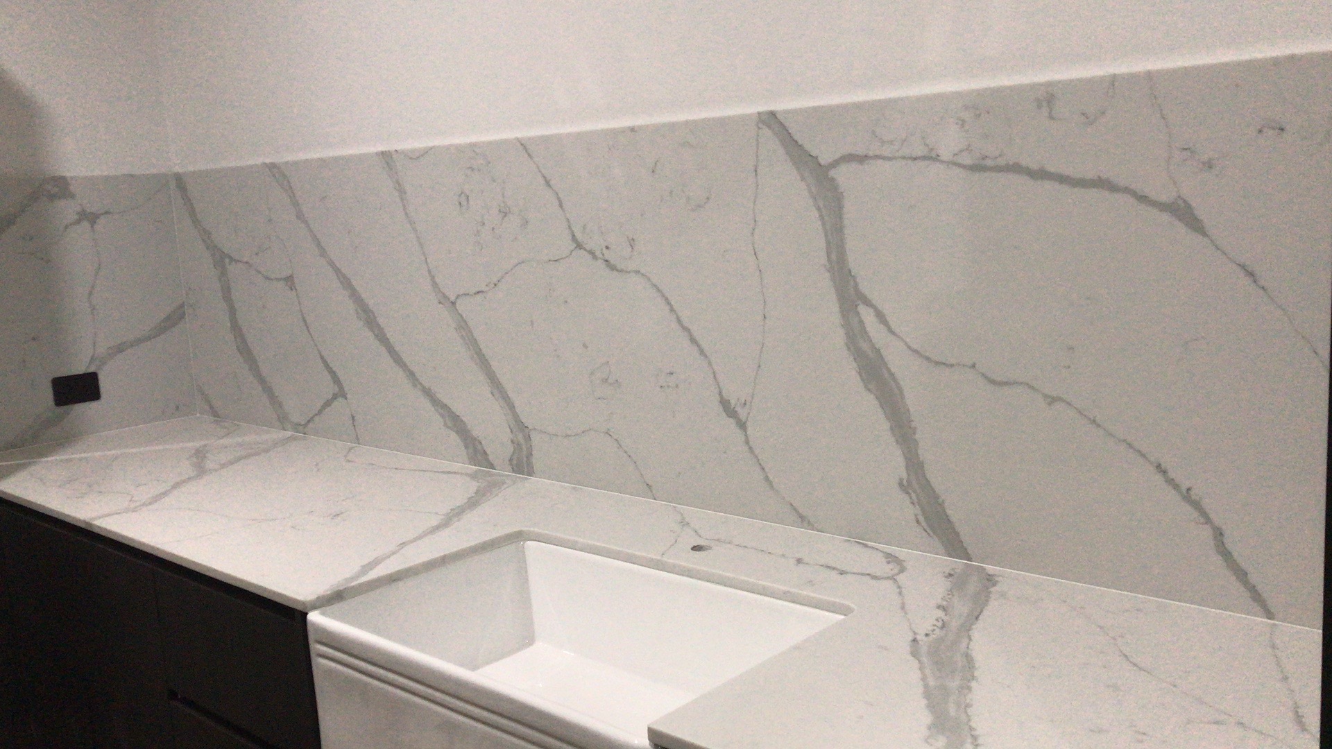 Natural stone benchtop tiles and splashback in Perth home